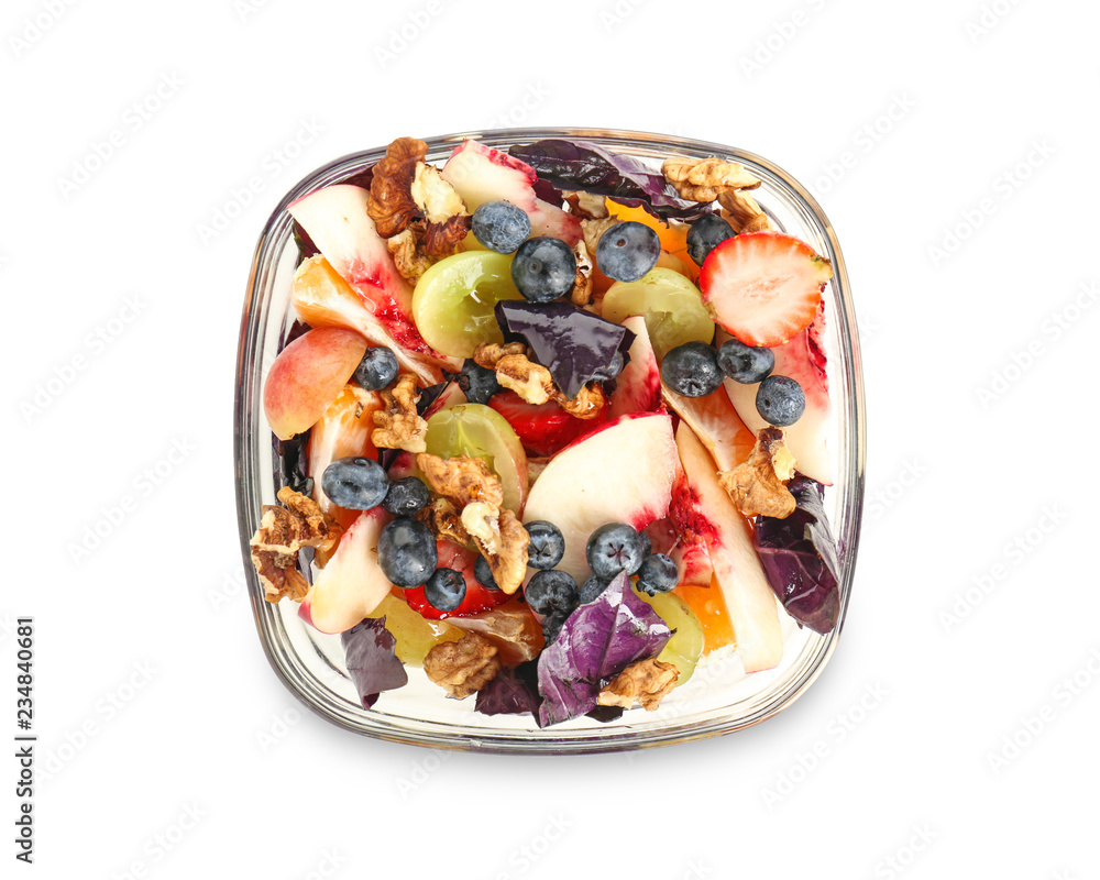 Delicious fresh salad with walnuts on plate, isolated on white