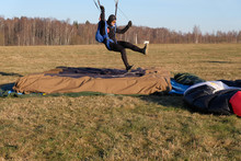 A Skydiver Is Landing And Touching The Target.
