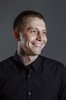 © Air_Lady - Portrait of determined goodlooking man wearing black shirt, black background.