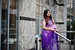 © AS Photo Family - Indian hindu girl at traditional violet saree posed at street.