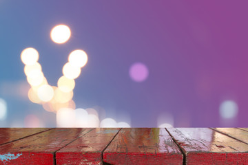 Canvas Print - wooden desk with blurred light bokeh abstract background