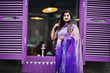 © AS Photo Family - Indian hindu girl at traditional violet saree posed at street against purple windows.