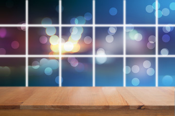 Canvas Print - wooden desk with blurred light bokeh abstract background