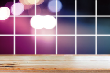 Canvas Print - wooden desk with blurred light bokeh abstract background