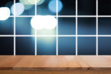 Canvas Print - wooden desk with blurred light bokeh abstract background