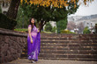 © AS Photo Family - Indian hindu girl at traditional violet saree posed at autumn street.