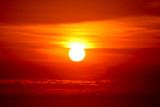 Fototapeta Zachód słońca - last light of sunset on the red cloud orange sky and ray around sun