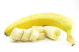 Fototapeta  - Ripe yellow banana with sliced bananas