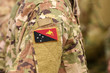 © Bumble Dee - Papua New Guinea flag on soldiers arm. Papua New Guinea troops (collage)