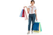 © LIGHTFIELD STUDIOS - happy young woman holding shopping bags and looking at camera isolated on white