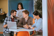© Viacheslav Yakobchuk - Merry four colleagues developing business plan