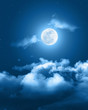 © taira42 - Mystical Night sky background with full moon, clouds and stars. Moonlight night with copy space for winter background
