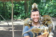 Handsome ethnic man with titi monkeys