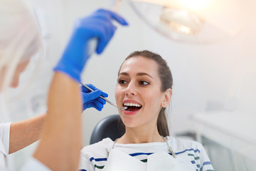 Sticker - Woman having teeth examined at dentists