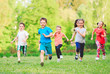 © davit85 - Many different kids, boys and girls running in the park on sunny summer day in casual clothes