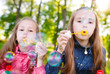 © davit85 - Girls play with soap bubbles.
