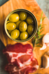 Poster - Marinated green olives in can.