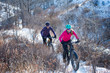 Two Women riding Fat Bikes in the Snow