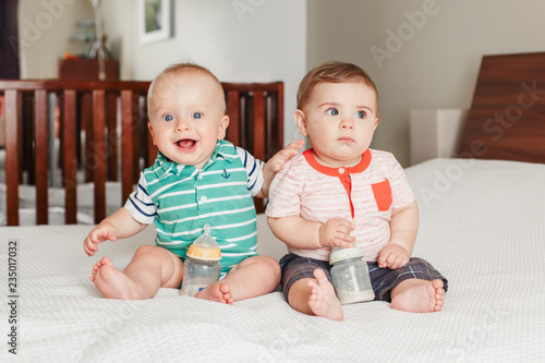 Group Portrait Of Two White Caucasian Cute Adorable Funny Baby