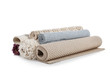 Different rolled carpets on white background. Interior element