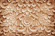 Pattern of flower carved on wood background