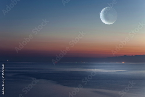 早朝の月と幻想的な海 Stock Photo Adobe Stock 早朝の月と幻想的な海 Stock Photo Adobe Stock