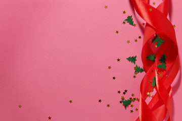 Red ribbon and confetti New year background with copy space