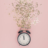 Fototapeta Konie - New Year concept. Alarm clock with golden confetti