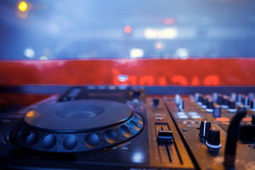 DJ sound equipment at nightclubs and music festivals, EDM, future house music and so on. Parties concept, sound technique. DJ playing on the best