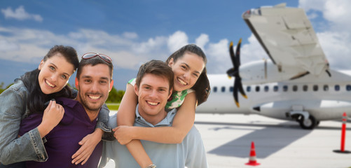 Sticker - tourism, travel and people concept - group of happy friends over plane on airfield background