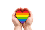 Fototapeta Tęcza - LGBT rainbow heart symbol of love in hands 