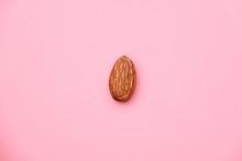Almond, Nuts On Pink Background.