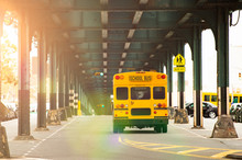 A School Bus Is Passing Under The Railway Bridge In The Bronx, New York City, USA.