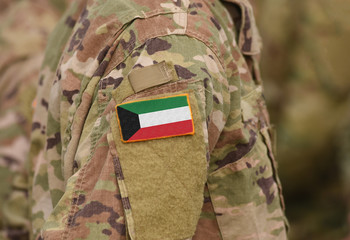 Kuwait flag on soldiers arm (collage).