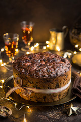 Traditional Christmas fruit cake on dark background