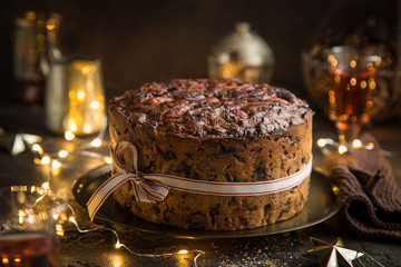 Traditional Christmas fruit cake on dark background