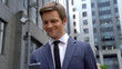 © motortion - Happy employee reading e-mail on phone, good news about promotion, startup