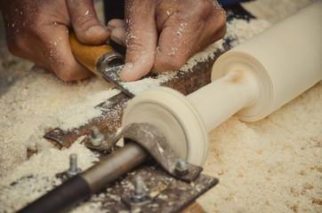 Carpenter working on woodworking machines in carpentry shop. Joiner carpenter workplace. Handmade and craft furniture concept