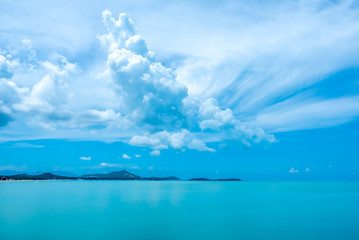 Seascape view under cloudy blue sky