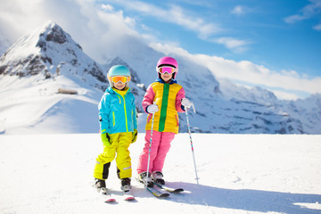 Wall Mural - Ski and snow winter fun for kids. Children skiing.