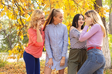 Summer autumn vacation, holidays, travel and people concept - group of young women in the park