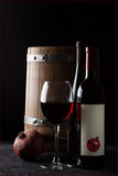 Fototapeta Panele - Still life with pomegranate wine on a black background