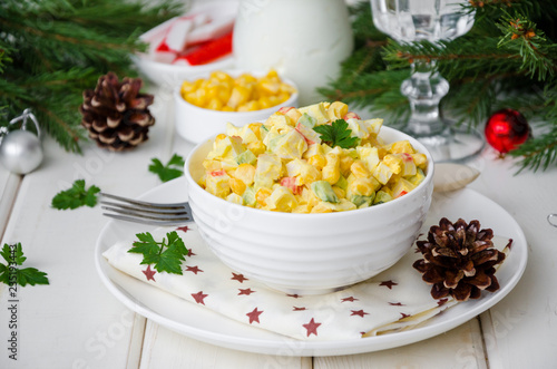 Fotografie, Obraz Traditional Russian salad with crab sticks, fresh cucumbers, corn and boiled egg