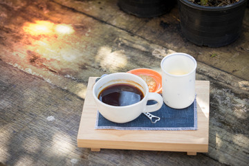 Morning coffee cup and wood background Coffee, cookies and sugar in a bottle.