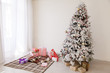 © dmitriisimakov - new year Christmas Home Interior White Christmas tree lights twinkle winter holiday gifts