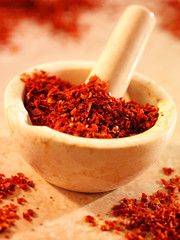 Wall Mural - RED PEPPER FLAKES IN PESTLE AND MORTAR