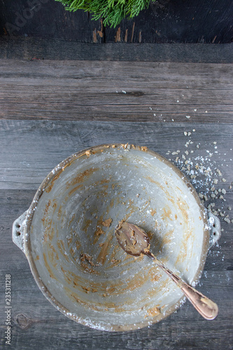 Fotografie, Obraz Empty mixing bowl with peanut butter remnants and spoon