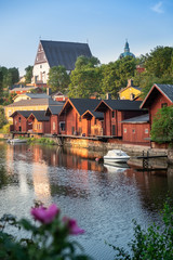 beautiful city landscape with idyllic river and old buildings at summer evening in porvoo, finland