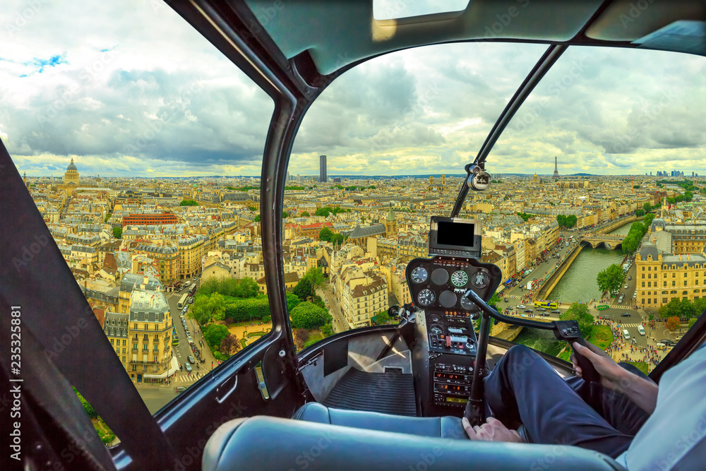 Helicopter cockpit flying on Notre Dame skyline of Paris, French capital, Europe. Scenic flight over Paris cityscape. - obrazy, fototapety, plakaty 