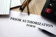 © piter2121 - Prior authorization form with pen, calculator and   glasses on desk